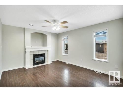 3732 28 Street, Edmonton, AB - Indoor Photo Showing Living Room With Fireplace