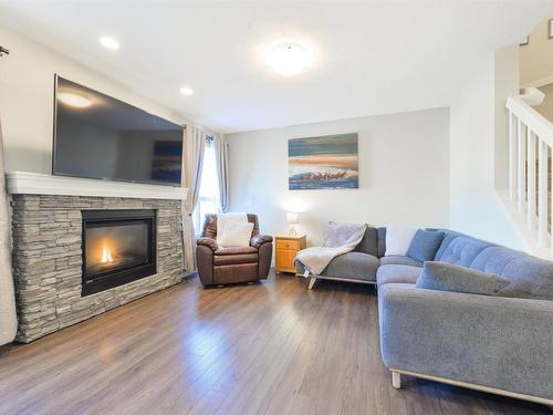 6839 Evans Wynd, Edmonton, AB - Indoor Photo Showing Living Room With Fireplace