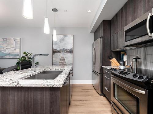 1404 11969 Jasper Avenue, Edmonton, AB - Indoor Photo Showing Kitchen With Stainless Steel Kitchen With Double Sink With Upgraded Kitchen