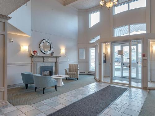 103 7951 96 Street, Edmonton, AB - Indoor Photo Showing Other Room With Fireplace