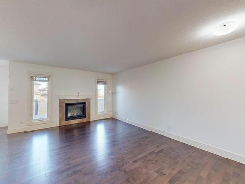 608 41 Ave, Edmonton, AB - Indoor Photo Showing Living Room With Fireplace