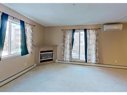 215 17459 98A Avenue, Edmonton, AB - Indoor With Fireplace