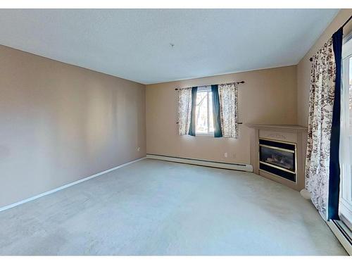 215 17459 98A Avenue, Edmonton, AB - Indoor With Fireplace