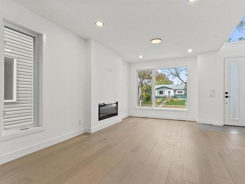 13843 110A Avenue, Edmonton, AB - Indoor Photo Showing Living Room With Fireplace