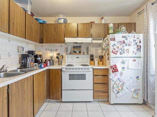 14606 54 St Nw, Edmonton, AB - Indoor Photo Showing Kitchen With Double Sink