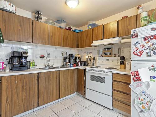 14606 54 St Nw, Edmonton, AB - Indoor Photo Showing Kitchen With Double Sink