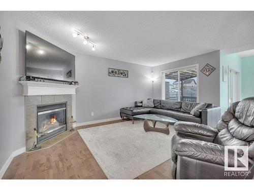 13734 37 Street Nw, Edmonton, AB - Indoor Photo Showing Living Room With Fireplace