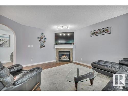 13734 37 Street Nw, Edmonton, AB - Indoor Photo Showing Living Room With Fireplace