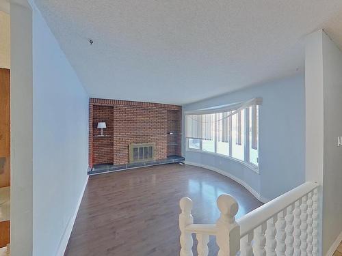 1139 Lakewood Road North, Edmonton, AB - Indoor Photo Showing Other Room With Fireplace