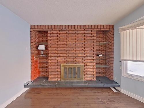 1139 Lakewood Road North, Edmonton, AB - Indoor Photo Showing Other Room With Fireplace