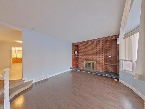 1139 Lakewood Road North, Edmonton, AB - Indoor Photo Showing Other Room With Fireplace