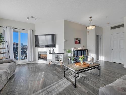 402 10606 102 Avenue, Edmonton, AB - Indoor Photo Showing Living Room With Fireplace