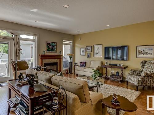 9 1225 Wanyandi Road, Edmonton, AB - Indoor Photo Showing Living Room With Fireplace