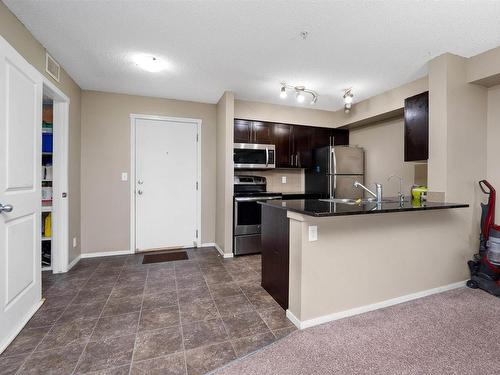 204 3315 James Mowatt Trail, Edmonton, AB - Indoor Photo Showing Kitchen With Stainless Steel Kitchen