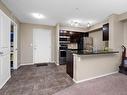 204 3315 James Mowatt Trail, Edmonton, AB  - Indoor Photo Showing Kitchen With Stainless Steel Kitchen 