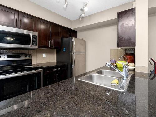 204 3315 James Mowatt Trail, Edmonton, AB - Indoor Photo Showing Kitchen With Stainless Steel Kitchen With Double Sink