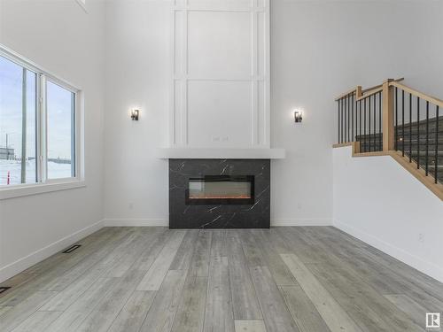 125 Wyatt Ridge, Fort Saskatchewan, AB - Indoor Photo Showing Living Room With Fireplace