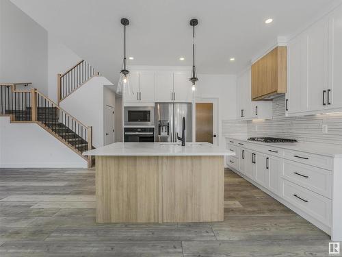 125 Wyatt Ridge, Fort Saskatchewan, AB - Indoor Photo Showing Kitchen With Upgraded Kitchen