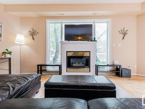 106 10933 82 Avenue, Edmonton, AB - Indoor Photo Showing Living Room With Fireplace