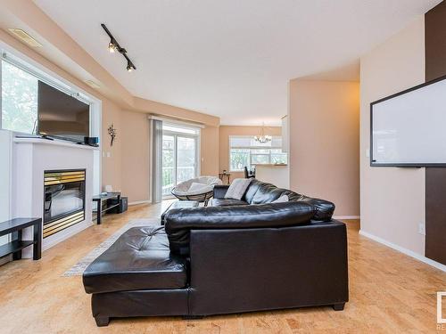 106 10933 82 Avenue, Edmonton, AB - Indoor Photo Showing Living Room With Fireplace