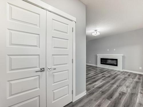 4705 36 Street, Beaumont, AB - Indoor Photo Showing Other Room With Fireplace