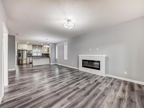 4705 36 Street, Beaumont, AB - Indoor Photo Showing Living Room With Fireplace