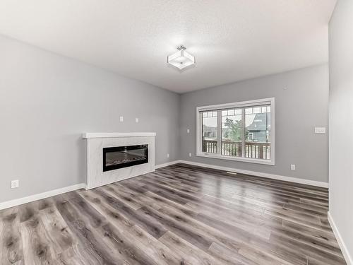 4705 36 Street, Beaumont, AB - Indoor Photo Showing Living Room With Fireplace