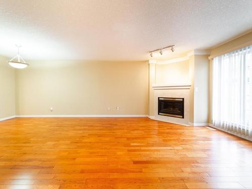 21 2419 133 Avenue, Edmonton, AB - Indoor Photo Showing Living Room With Fireplace