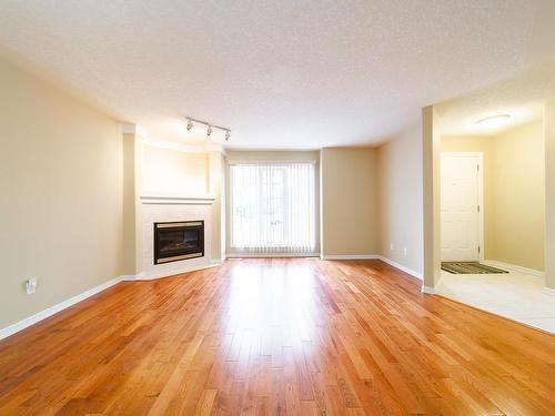 21 2419 133 Avenue, Edmonton, AB - Indoor Photo Showing Living Room With Fireplace