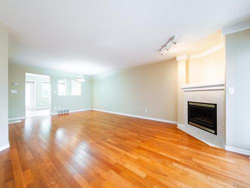 21 2419 133 Avenue, Edmonton, AB - Indoor Photo Showing Other Room With Fireplace