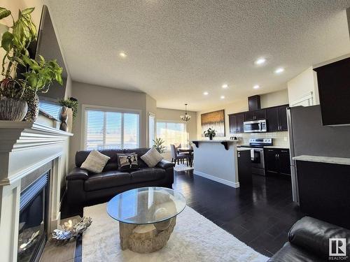 1408 33B Street, Edmonton, AB - Indoor Photo Showing Living Room With Fireplace