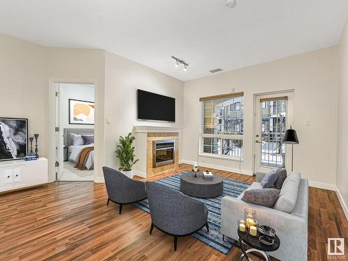 107 1003 Gault Boulevard, Edmonton, AB - Indoor Photo Showing Living Room With Fireplace