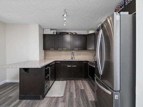 109 14808 125 Street, Edmonton, AB - Indoor Photo Showing Kitchen With Stainless Steel Kitchen With Upgraded Kitchen