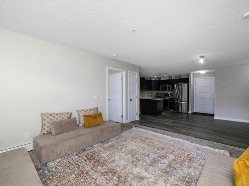 109 14808 125 Street, Edmonton, AB - Indoor Photo Showing Living Room