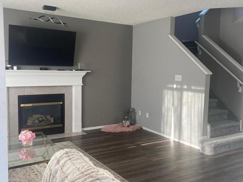 127 Ward Crescent, Edmonton, AB - Indoor Photo Showing Living Room With Fireplace