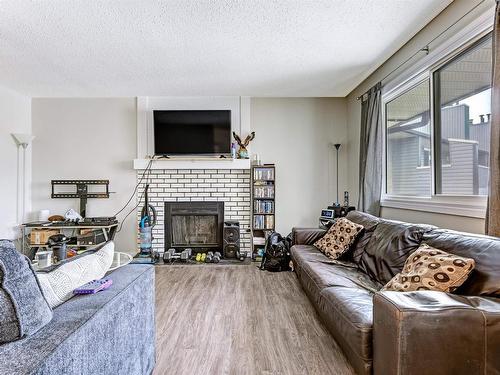 302 6204 180 Street, Edmonton, AB - Indoor Photo Showing Living Room With Fireplace