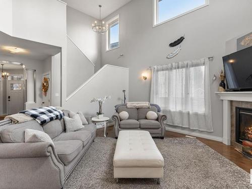 Stony Plain, AB - Indoor Photo Showing Living Room With Fireplace