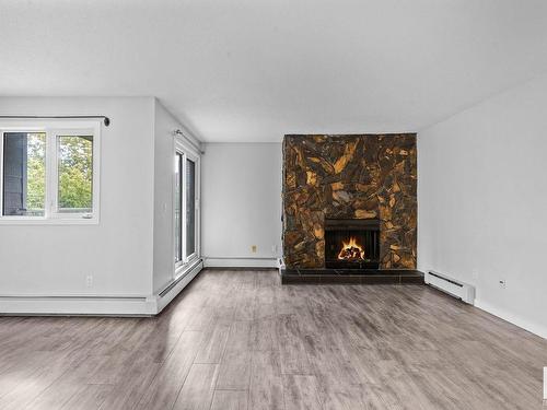 203 10138 116 Street, Edmonton, AB - Indoor Photo Showing Living Room With Fireplace