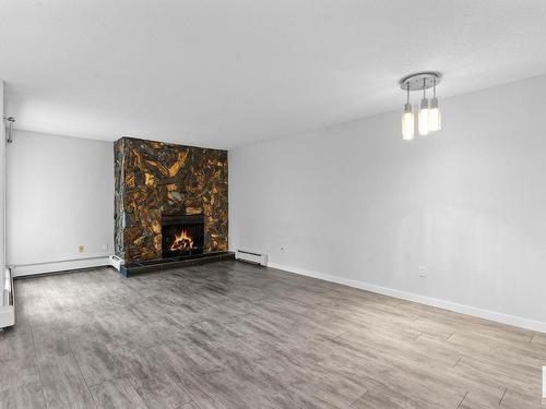 203 10138 116 Street, Edmonton, AB - Indoor Photo Showing Living Room With Fireplace