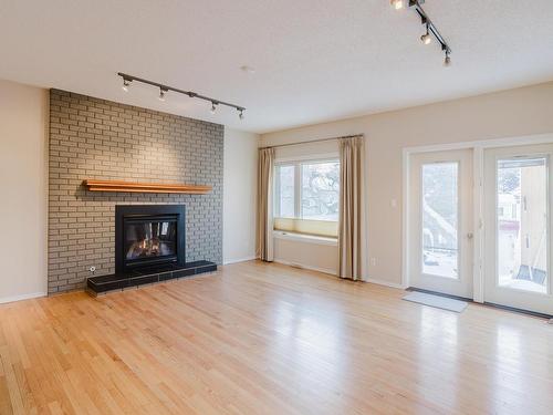 Edmonton, AB - Indoor Photo Showing Living Room With Fireplace