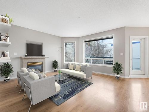 303 8108 109 Street, Edmonton, AB - Indoor Photo Showing Living Room With Fireplace