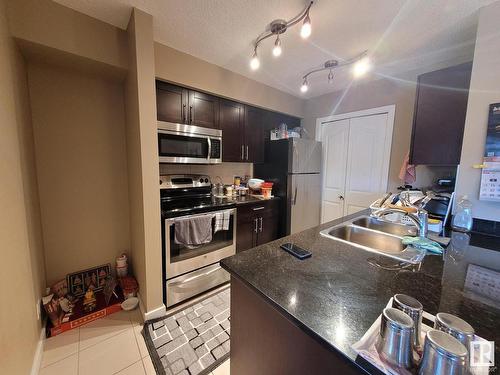 407 12025 22 Avenue, Edmonton, AB - Indoor Photo Showing Kitchen With Double Sink