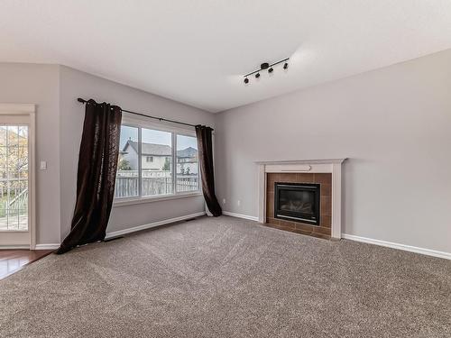 203 Caldwell Way, Edmonton, AB - Indoor Photo Showing Living Room With Fireplace