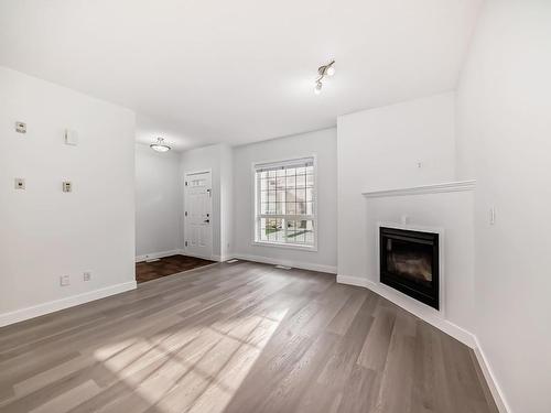 32 13825 155 Avenue, Edmonton, AB - Indoor Photo Showing Living Room With Fireplace