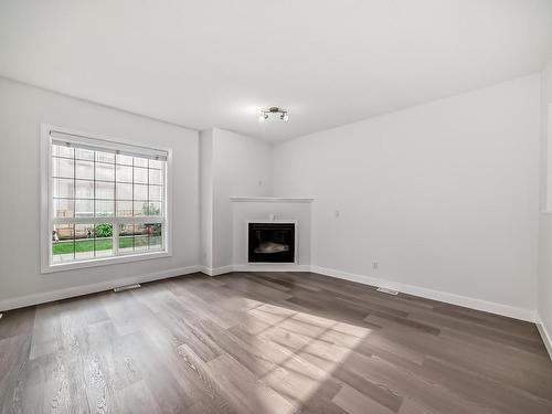 32 13825 155 Avenue, Edmonton, AB - Indoor Photo Showing Living Room With Fireplace