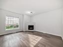 32 13825 155 Avenue, Edmonton, AB  - Indoor Photo Showing Living Room With Fireplace 