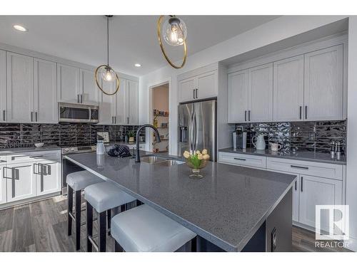 4 Hull Wynd, Spruce Grove, AB - Indoor Photo Showing Kitchen With Stainless Steel Kitchen With Double Sink With Upgraded Kitchen