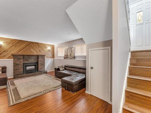 6416 11 Avenue, Edmonton, AB - Indoor Photo Showing Living Room With Fireplace