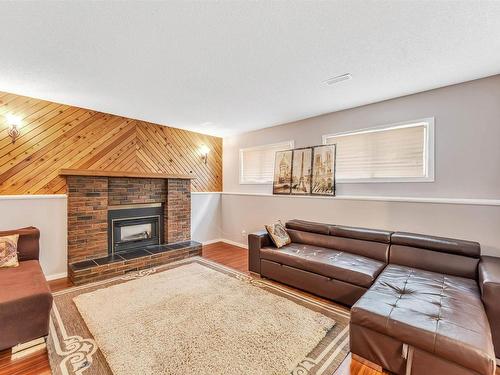 6416 11 Avenue, Edmonton, AB - Indoor Photo Showing Living Room With Fireplace