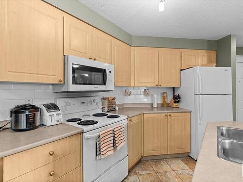 203 622 Mcallister Loop, Edmonton, AB - Indoor Photo Showing Kitchen With Double Sink